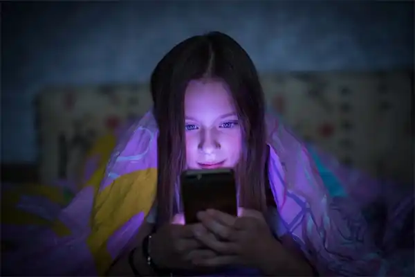 Looking at a mobile screen with darker lighting can affect your eyes.