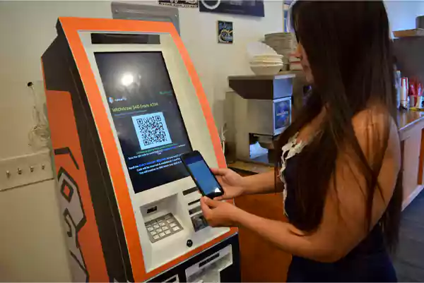 Scan the QR code shown on the Bitcoin ATM to withdraw